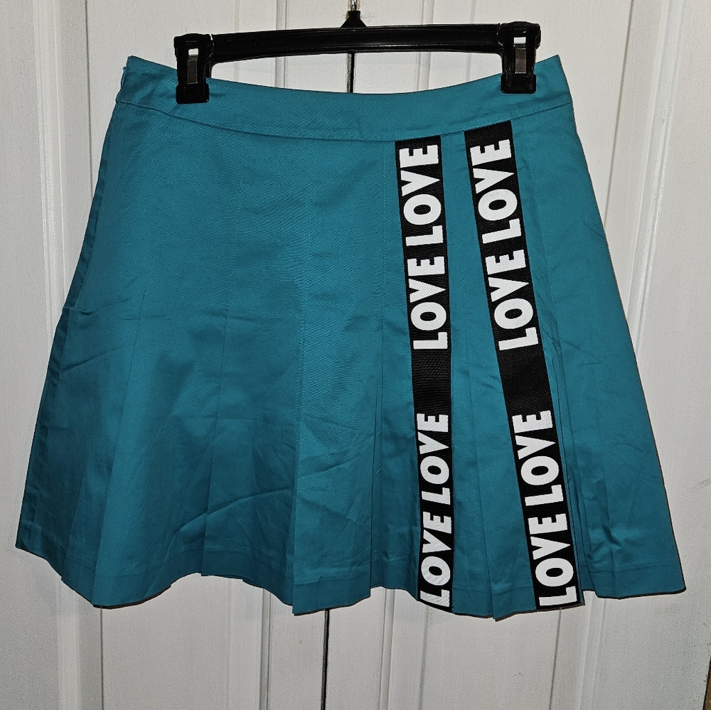Vese teal blue pleated skirt with LOVE printed on black bands.